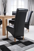 Krista Roll Back Bonded Leather Black Dining Chair - Blythe Living