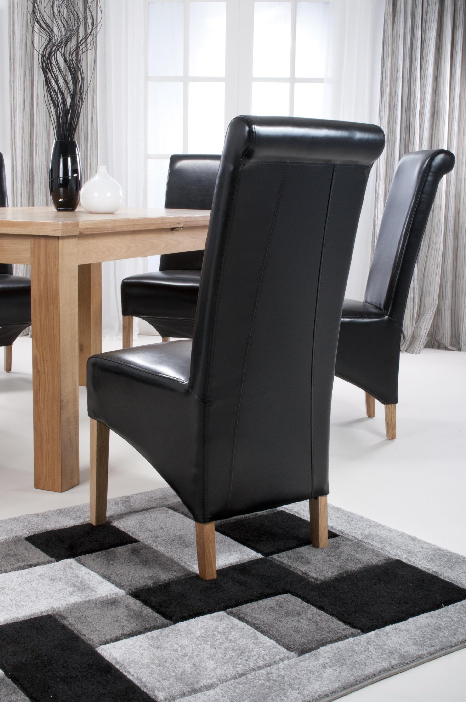 Krista Roll Back Bonded Leather Black Dining Chair - Blythe Living