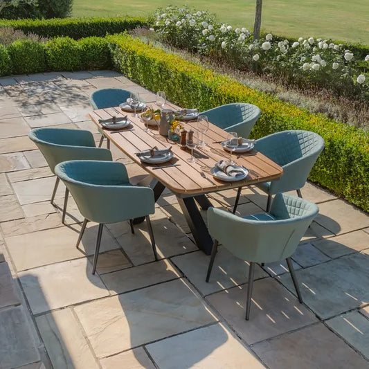 Maze - Jakarta Teak Oval Dining Table
with 6 Outdoor Fabric Ambition Sage Green Dining Chairs - Blythe Living