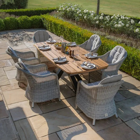 Maze - Jakarta Teak Oval Dining Table
with 6 Oxford Hertiage Rattan Dining Chairs - Blythe Living