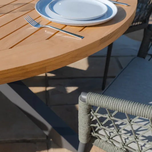 Maze - Jakarta Teak Round Dining Table
with 6 Monaco Ivy Green Rope Weave Dining Chairs - Blythe Living