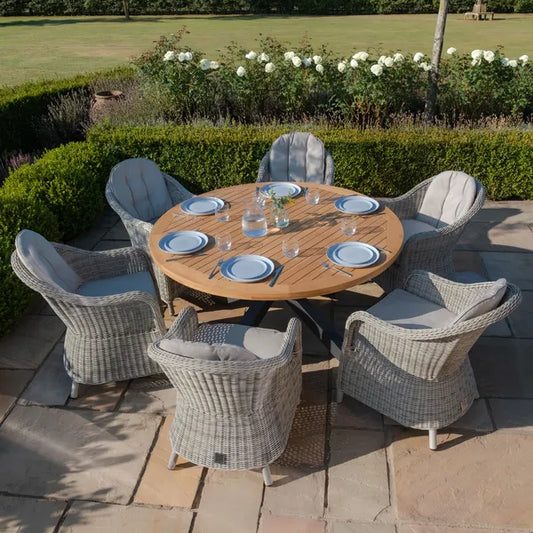 Maze - Jakarta Teak Round Dining Table
with 6 Oxford Hertiage Rattan Dining Chairs - Blythe Living