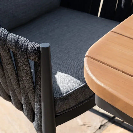 Maze - Jakarta Teak Oval Dining Table
with 6 Milan Charcoal Rope Weave Dining Chairs - Blythe Living