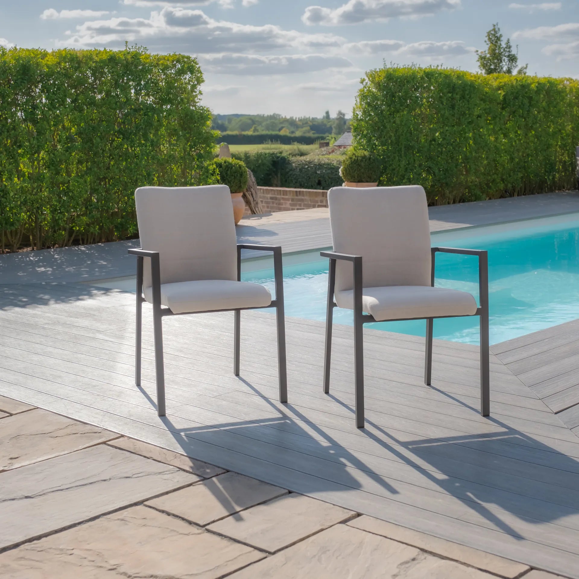 Maze - Jakarta Teak Extending 6 - 10 Seat Rectangular Dining Table
with 10 Ibiza Oatmeal Dining Chairs - Blythe Living