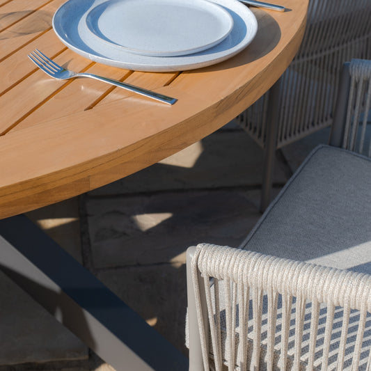 Maze - Jakarta Teak Round Dining Table
with 6 Maldives Rope Weave Dining Chairs - Blythe Living