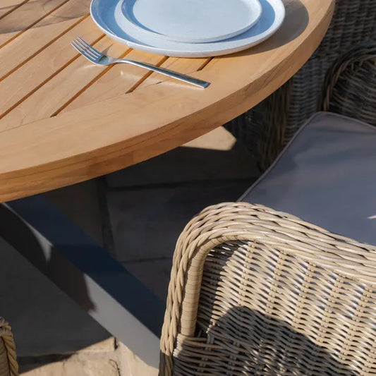 Maze - Jakarta Teak Round Dining Table
with 6 Winchester Heritage Rattan Dining Chairs - Blythe Living