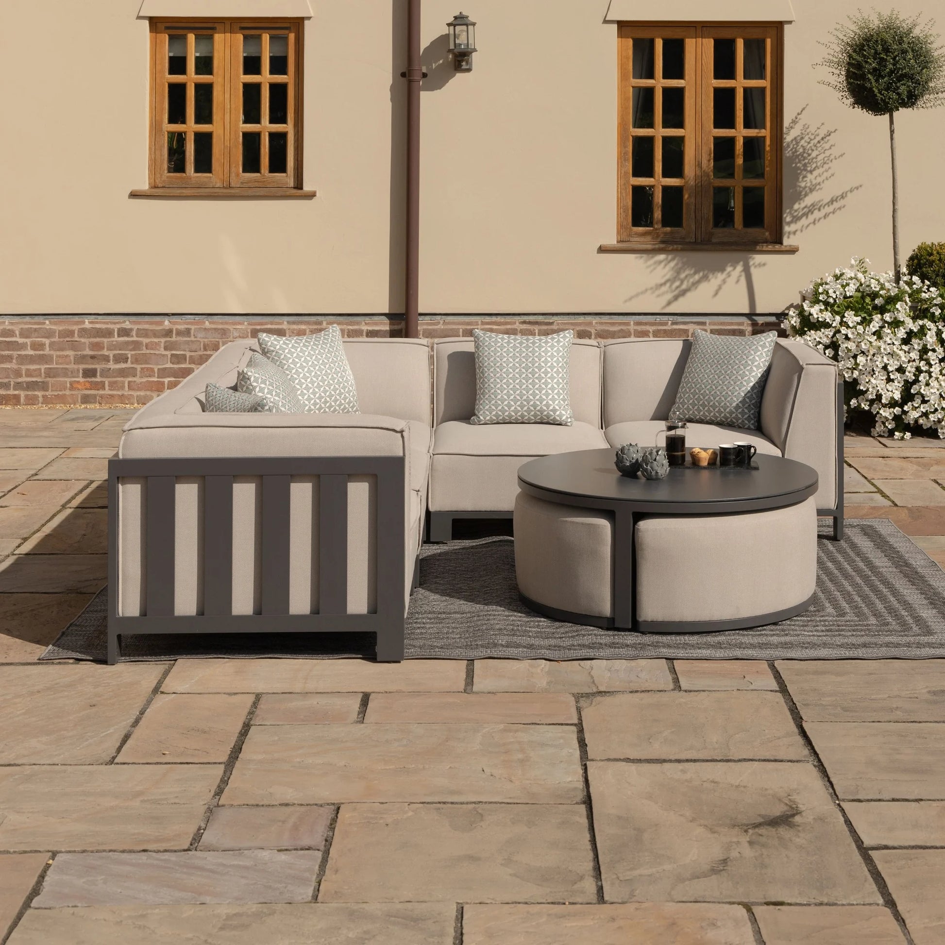 Maze - Outdoor Fabric Ibiza Small Corner Sofa Set with Round Coffee Table & 3 Footstools - Oatmeal - Blythe Living