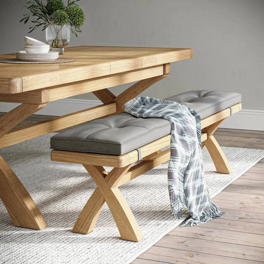 Buy chunky oak 200cm cross legged dining bench grey fabric seat free UK delivery
