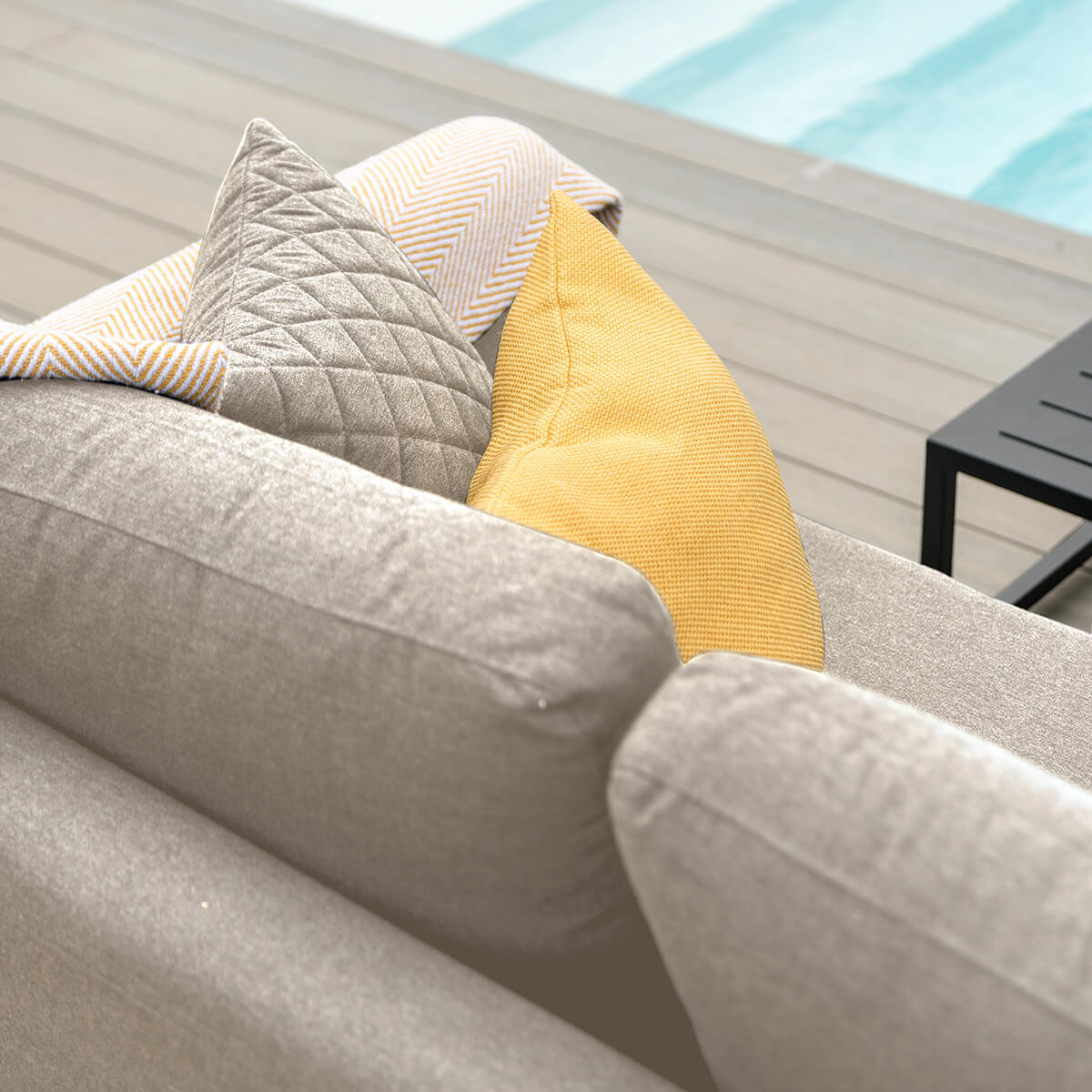 Explore premium outdoor lounge furniture with ceramic glass table