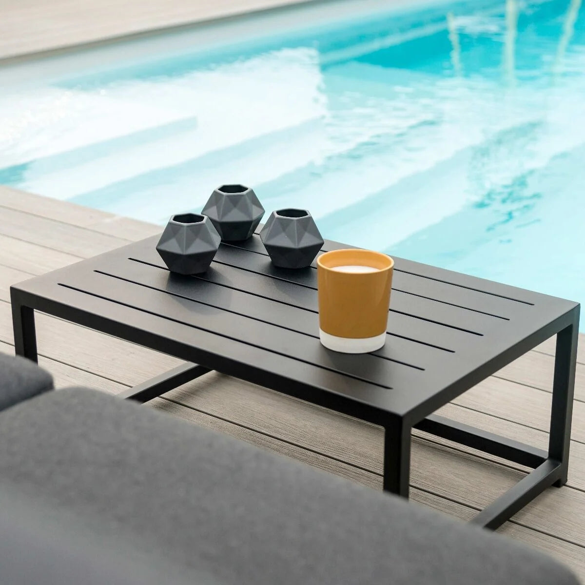 Explore premium outdoor lounge furniture with ceramic glass table