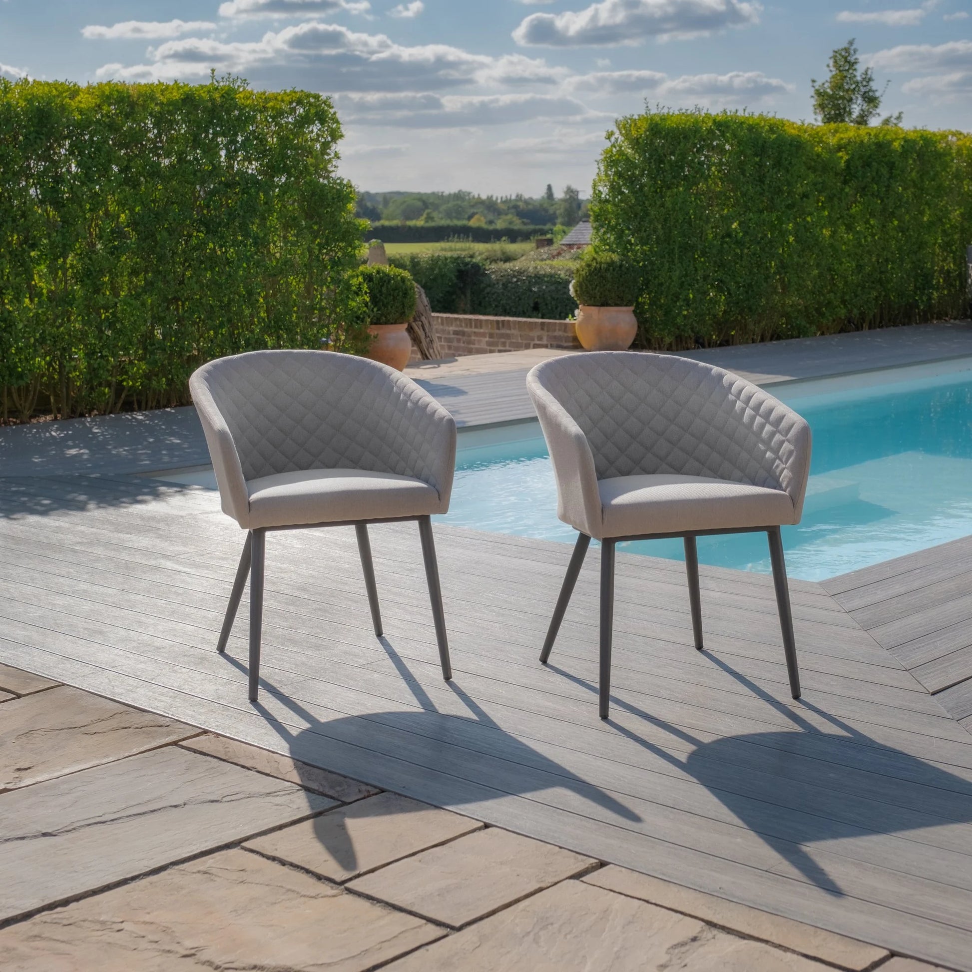 Shop outdoor fabric ambition oatmeal chairs with teak table
